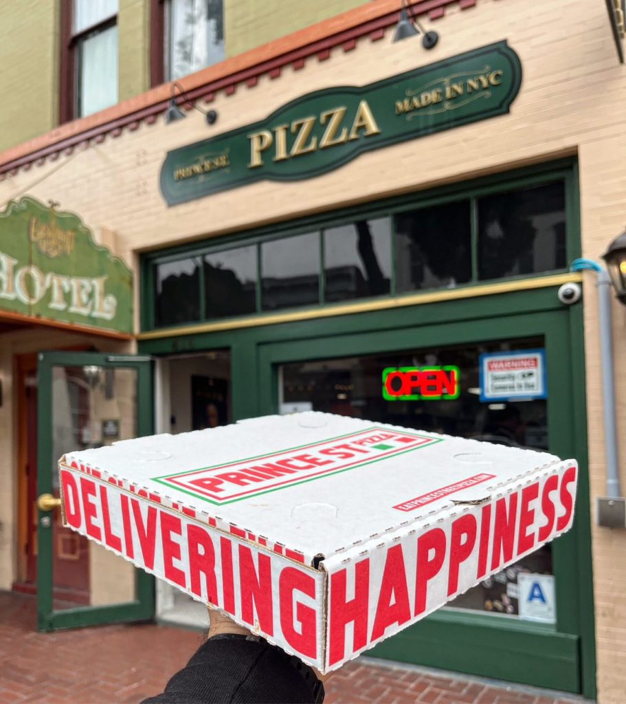 Pizza Box in front of Pizza restaurant
